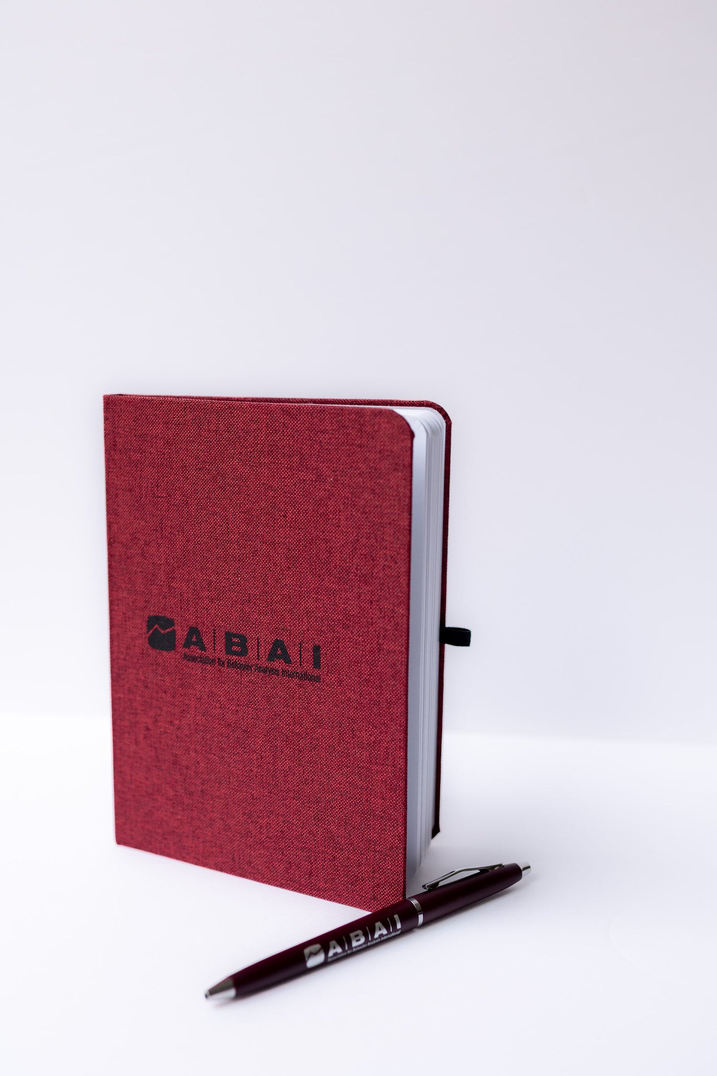 Maroon ABAI Notebook with Pen