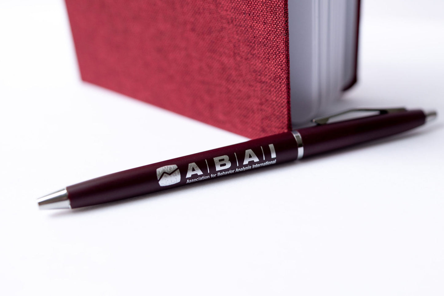 Maroon ABAI Notebook with Pen